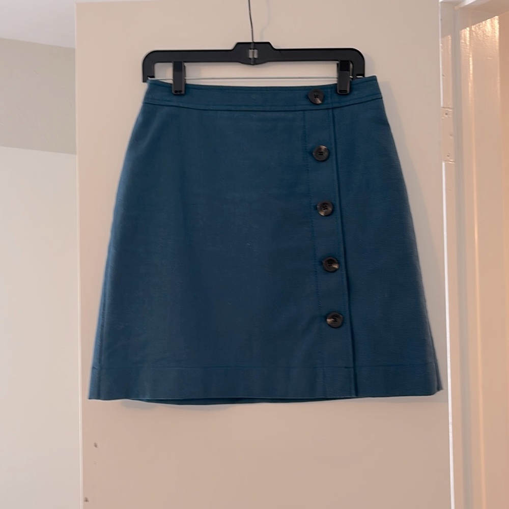 Ann Taylor structured peacock blue mini skirt with side buttons